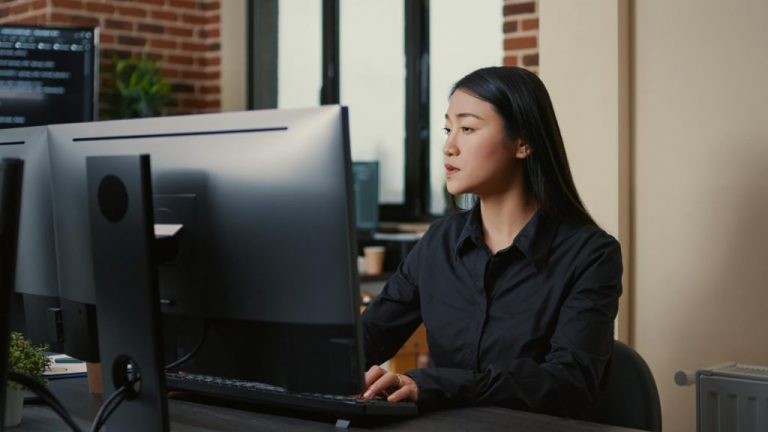 portrait-asian-programer-focused-writing-code-sitting-desk-software-development-office-system-engineer-concentrating-creating-algorithm-it-startup-company-1024x576